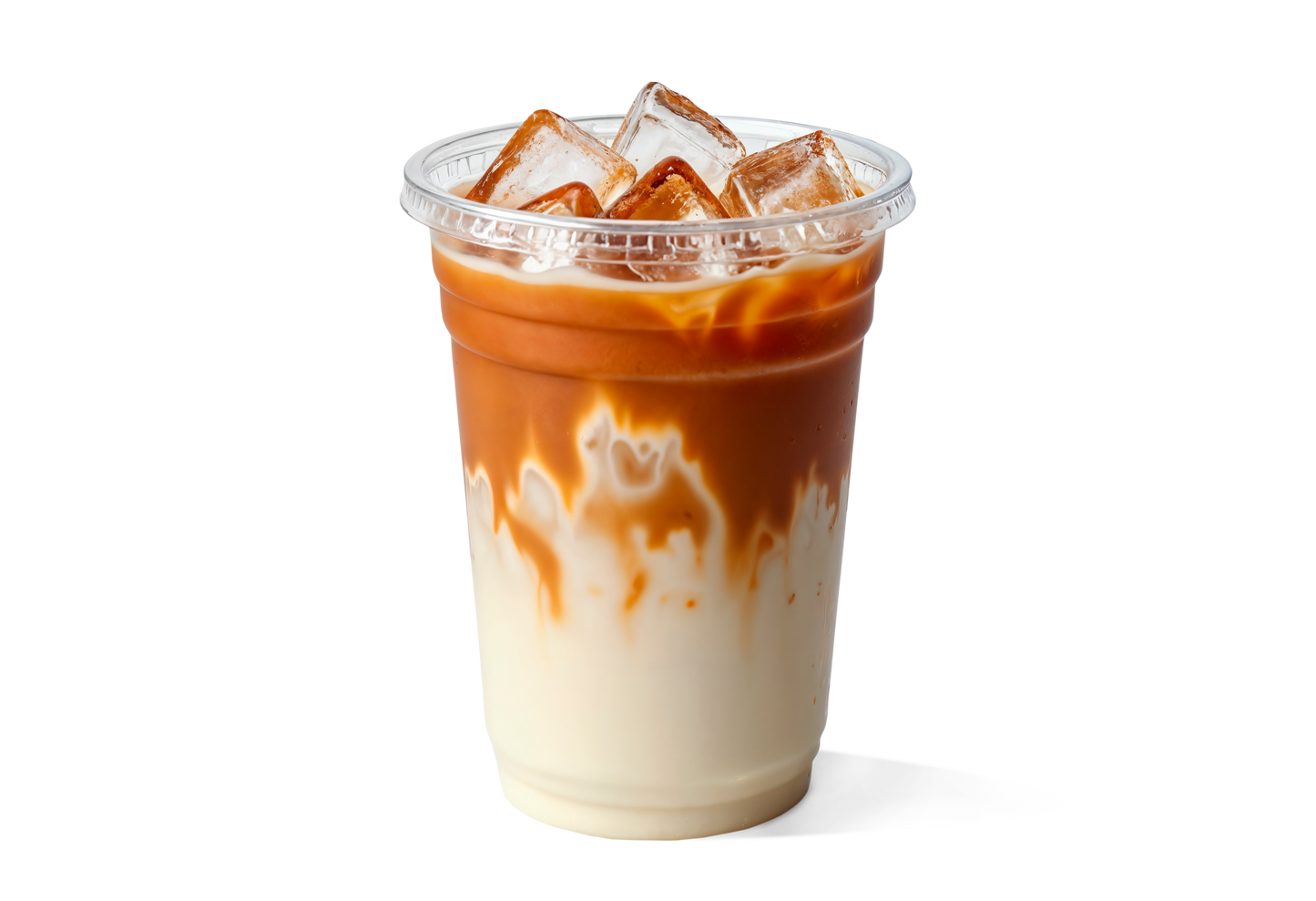 Iced coffee with a gradient of white to brown in a clear plastic cup on a white background