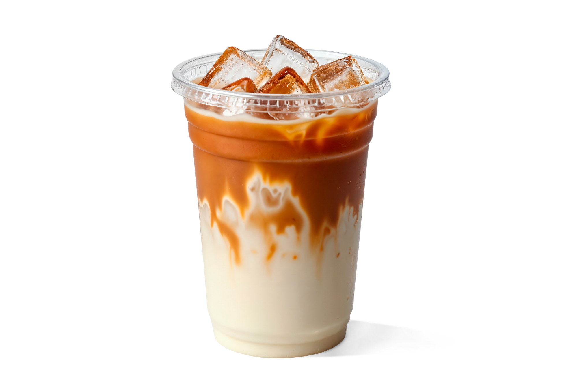 Iced coffee with a gradient of white to brown in a clear plastic cup on a white background
